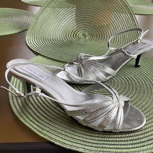 Silver evening sandal shoes.